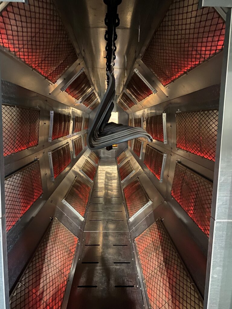 Inside of a TITAN-Catalytic oven powder coating parts for a client